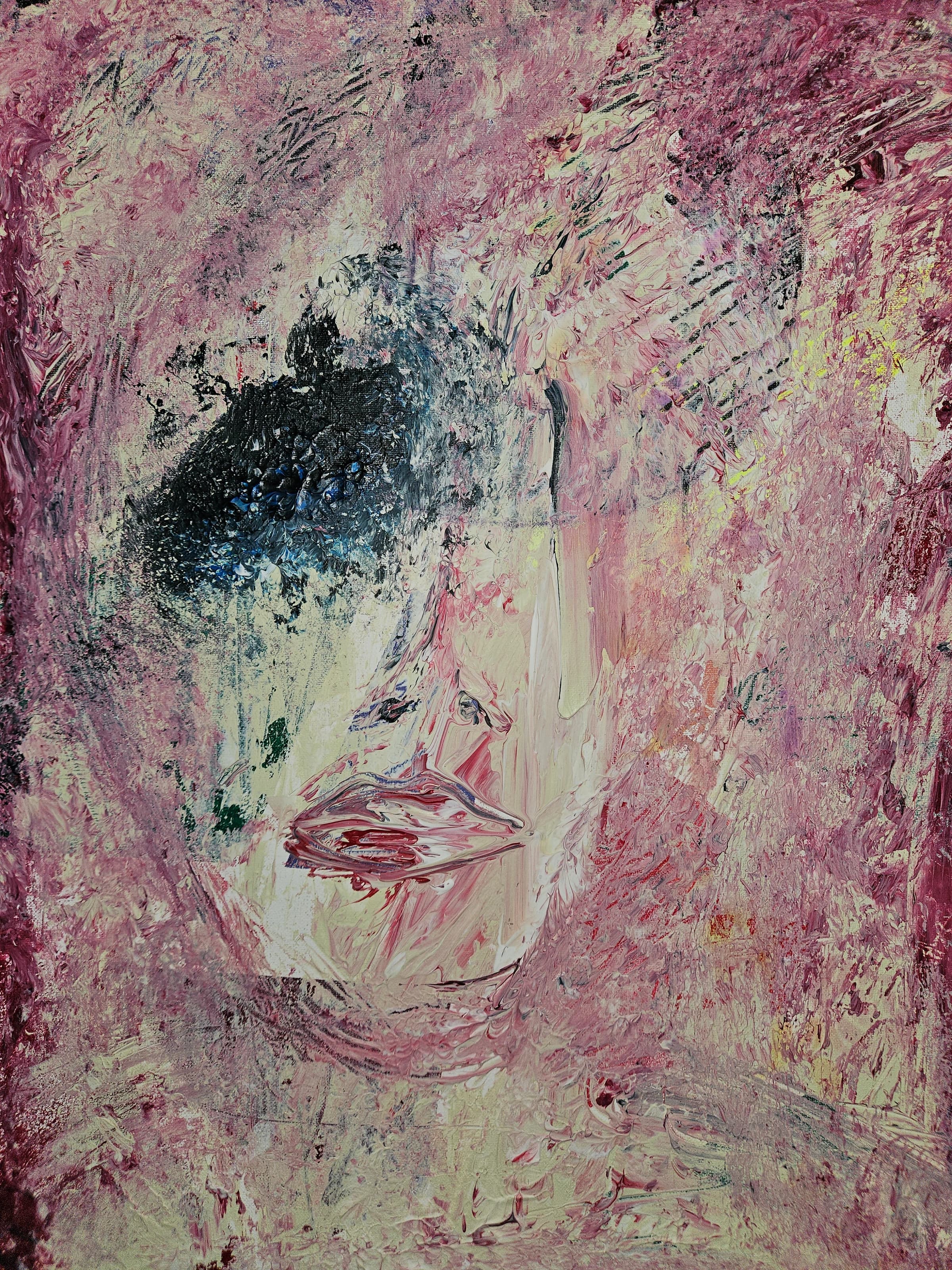 Expressive painted face in pale pink and cream with dark blue-black eyes.